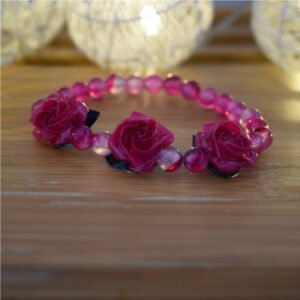 Pulsera de rosas de origami con accesorios en plata